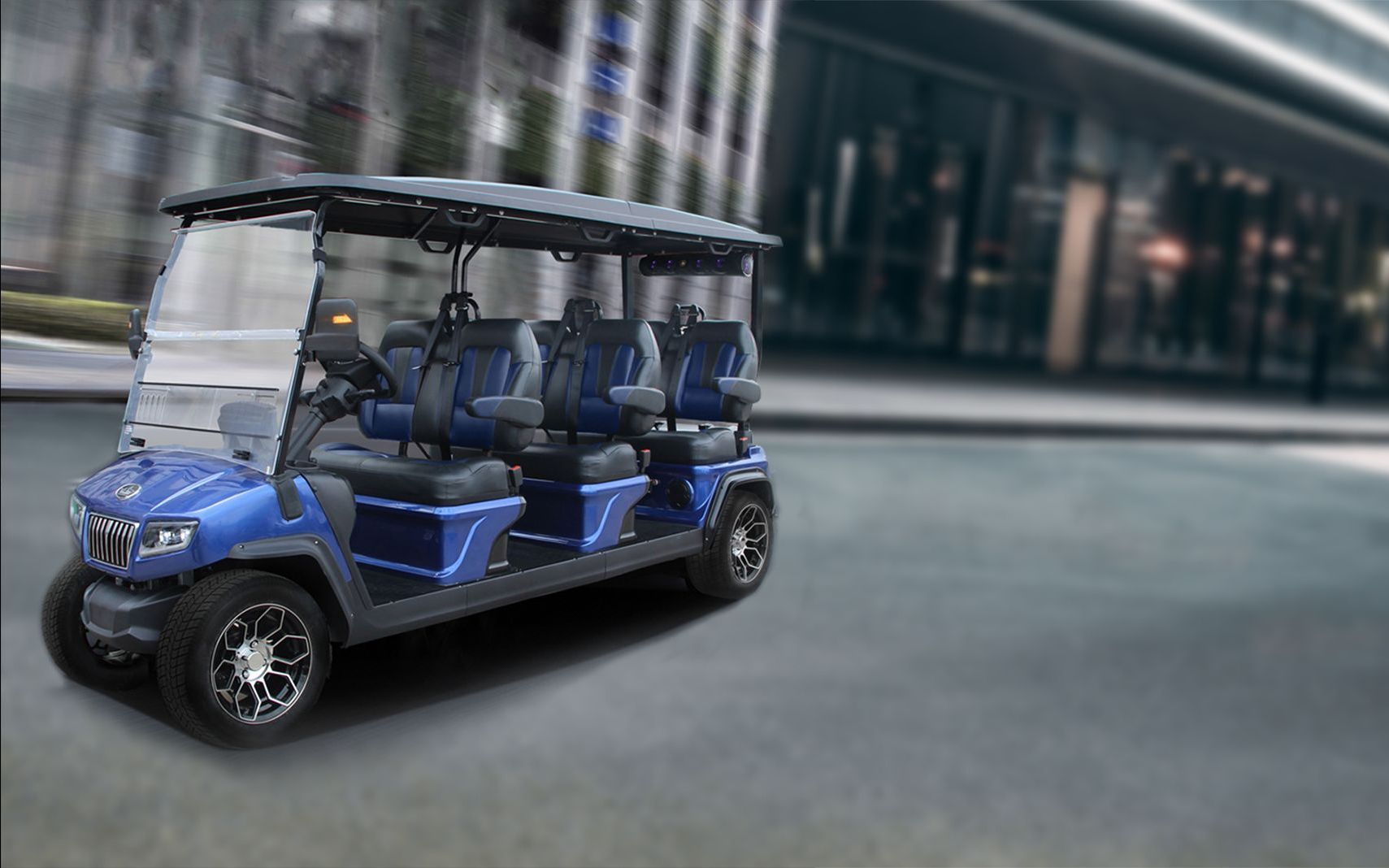 a blue golf cart is driving down a city street .