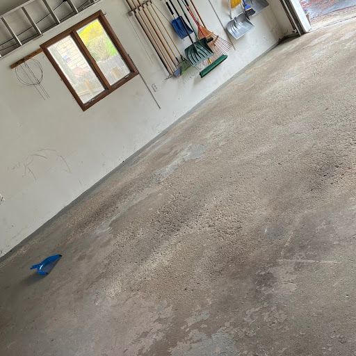 A garage with a lot of tools hanging on the wall.