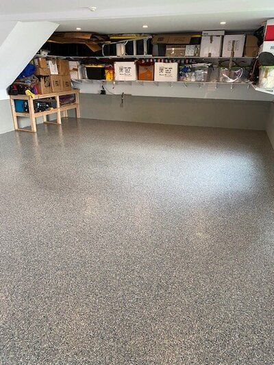 A garage filled with lots of boxes and boxes on the floor.