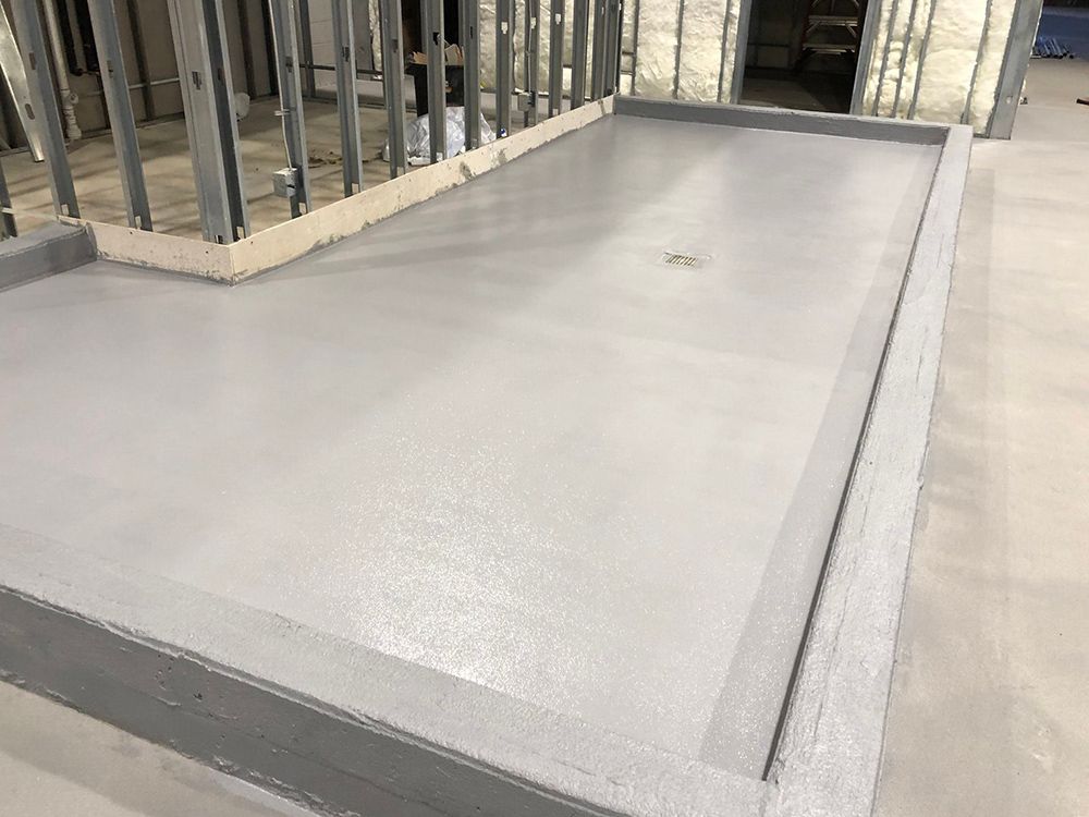 A large brewery with a concrete floor and a lot of stairs.