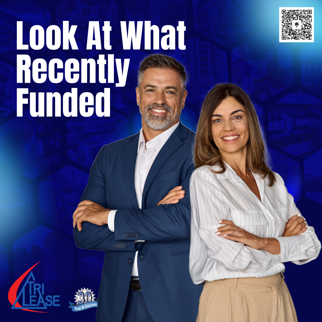 2 business people standing and smiling, with