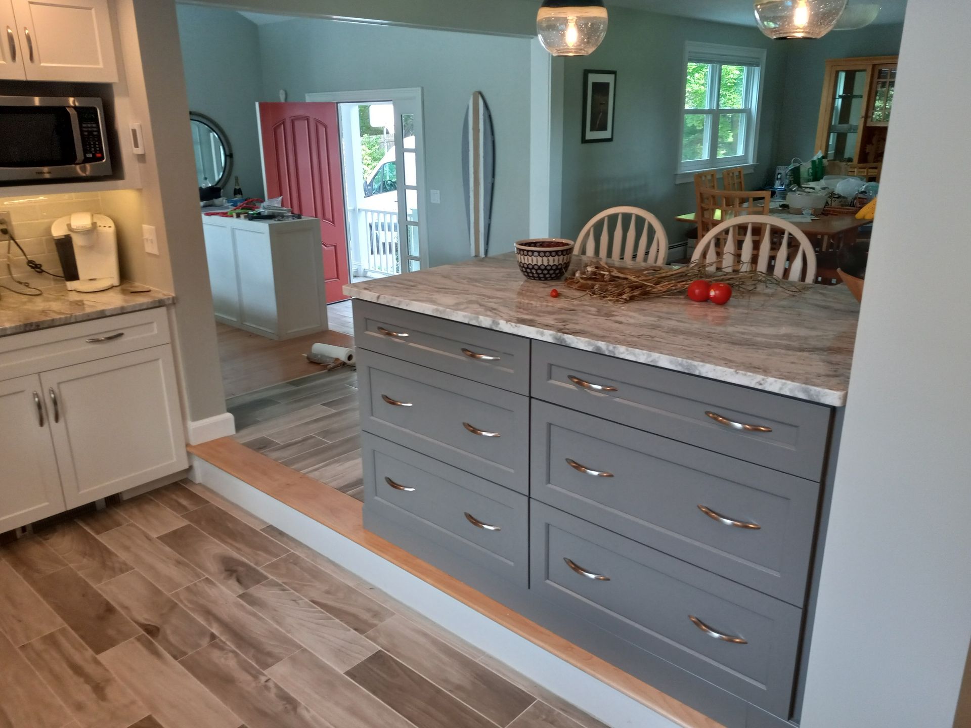 A kitchen with a large island in the middle of the room.