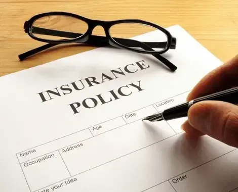 Insurance policy form on a desk in an office, representing policy documentation
