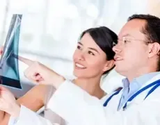 Healthcare professional discussing medical results, illustrating the importance of health insurance