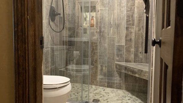 Bathroom with a toilet and a walk in shower