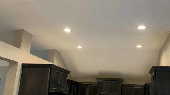 Kitchen with black cabinets and a white ceiling
