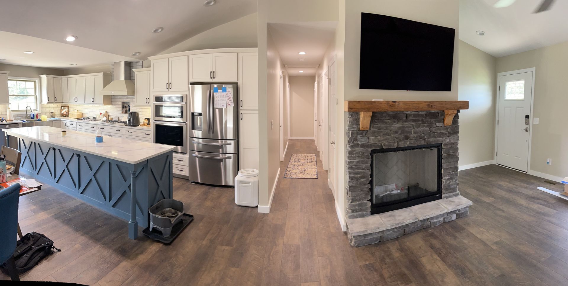 A panoramic view of the kitchen