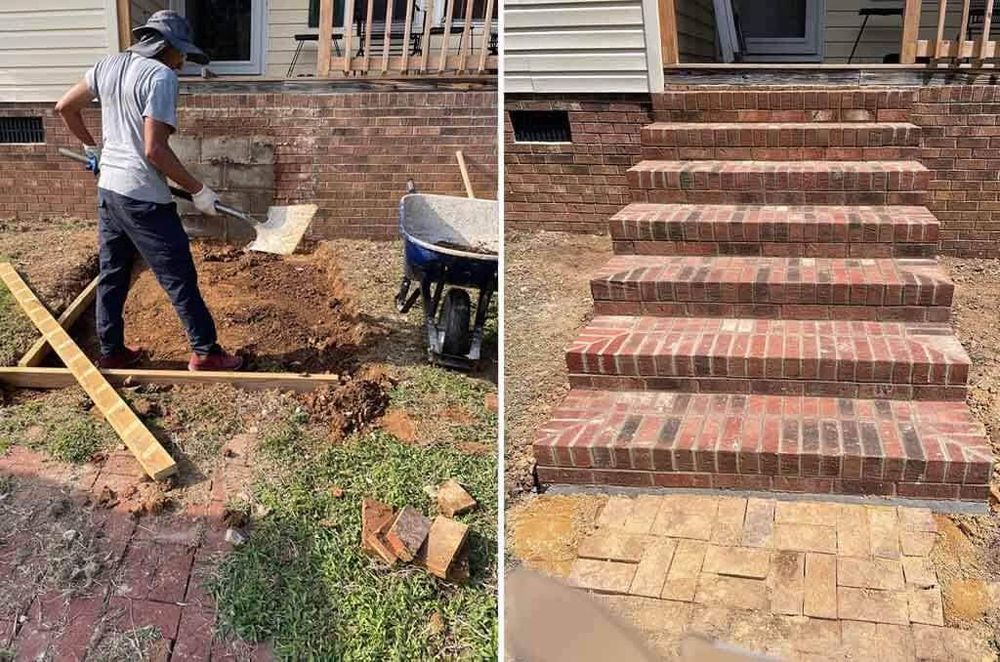 A man is laying brick steps in front of a house