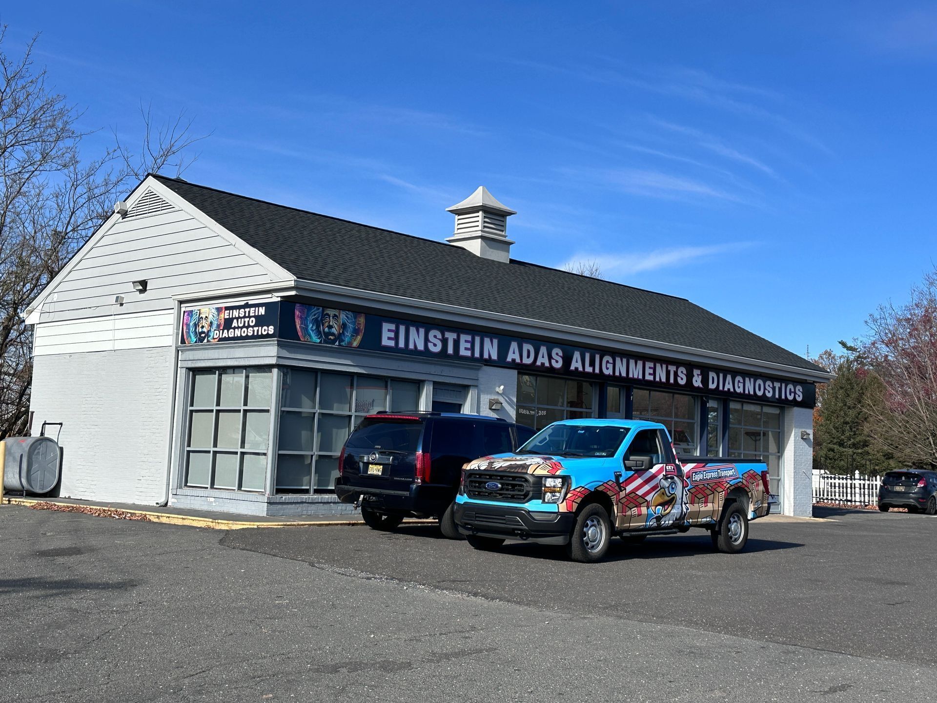 Einstein ADAS Alignments & Auto Repair shop with a colorful truck parked out front.
