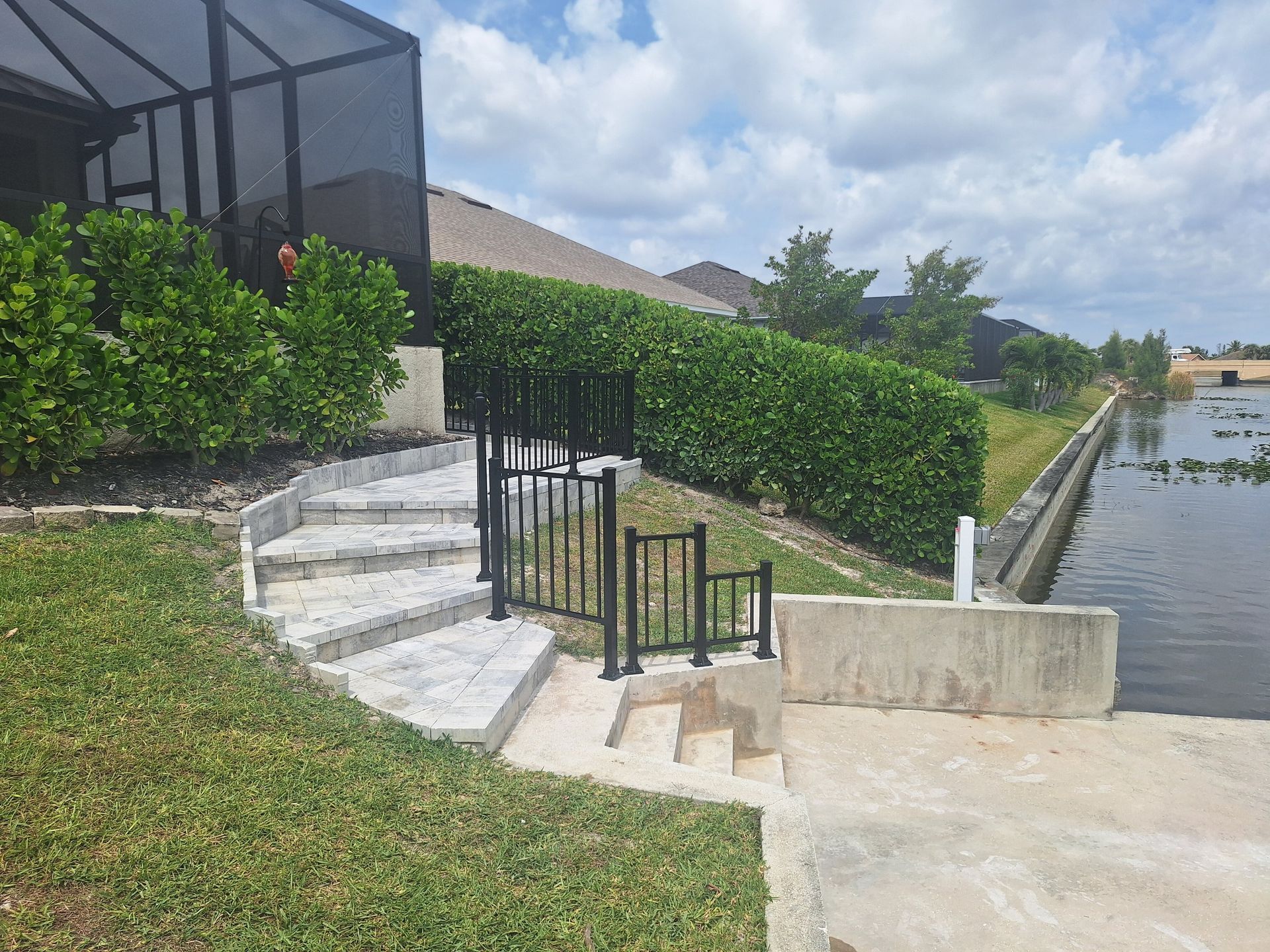 A staircase leading up to a dock next to a body of water.