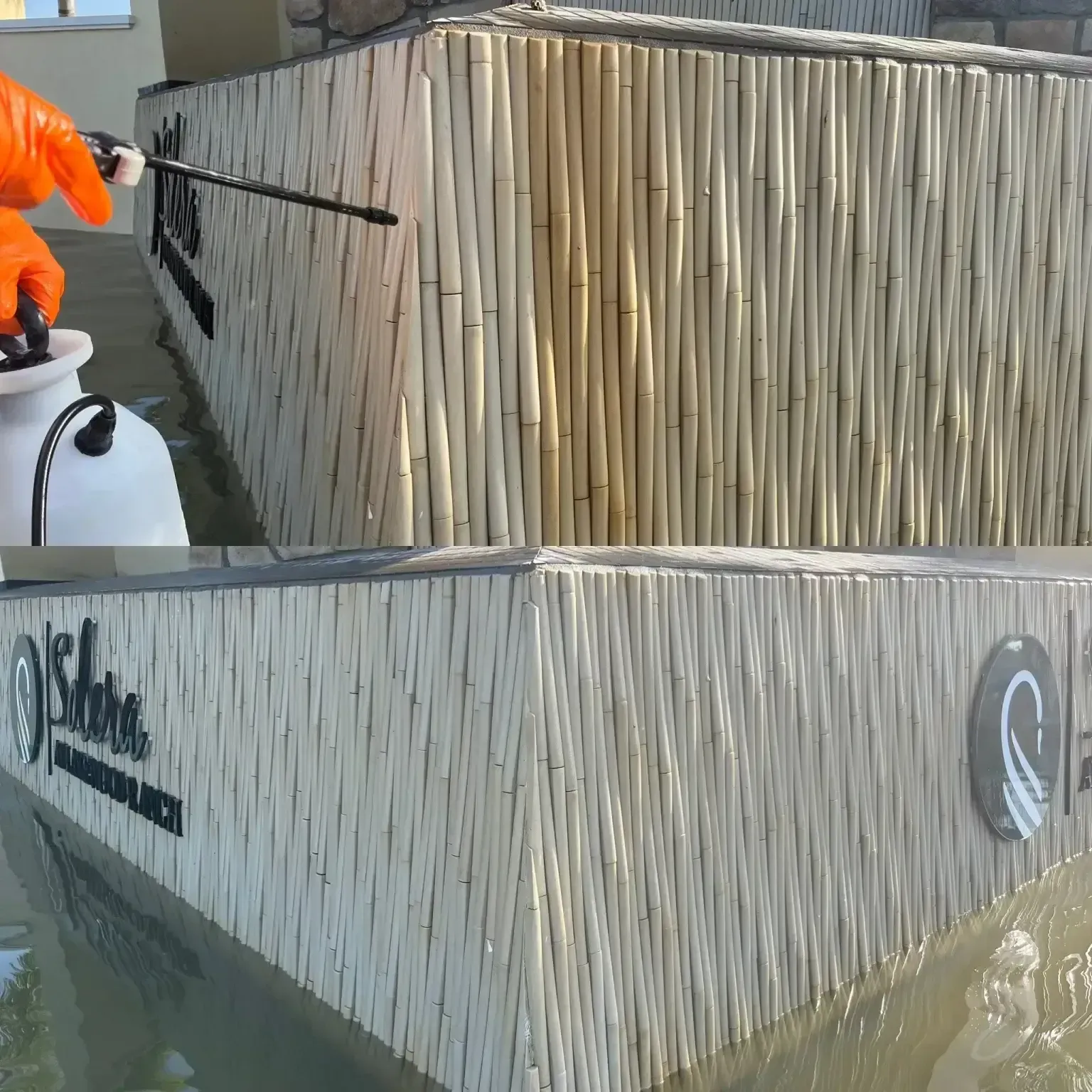 Person spraying a white boat hull with a black nozzle on a dockside work area