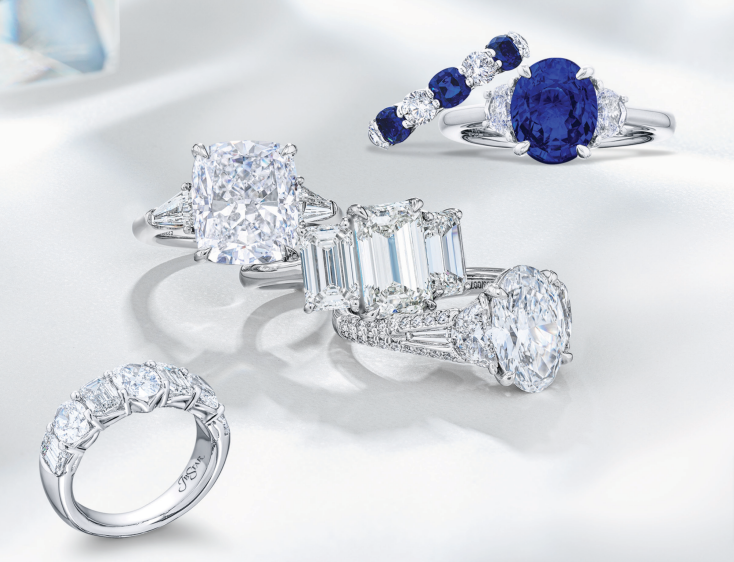 A group of rings sitting on top of each other on a white surface.