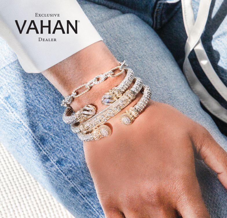 A woman wearing a stack of bracelets on her wrist