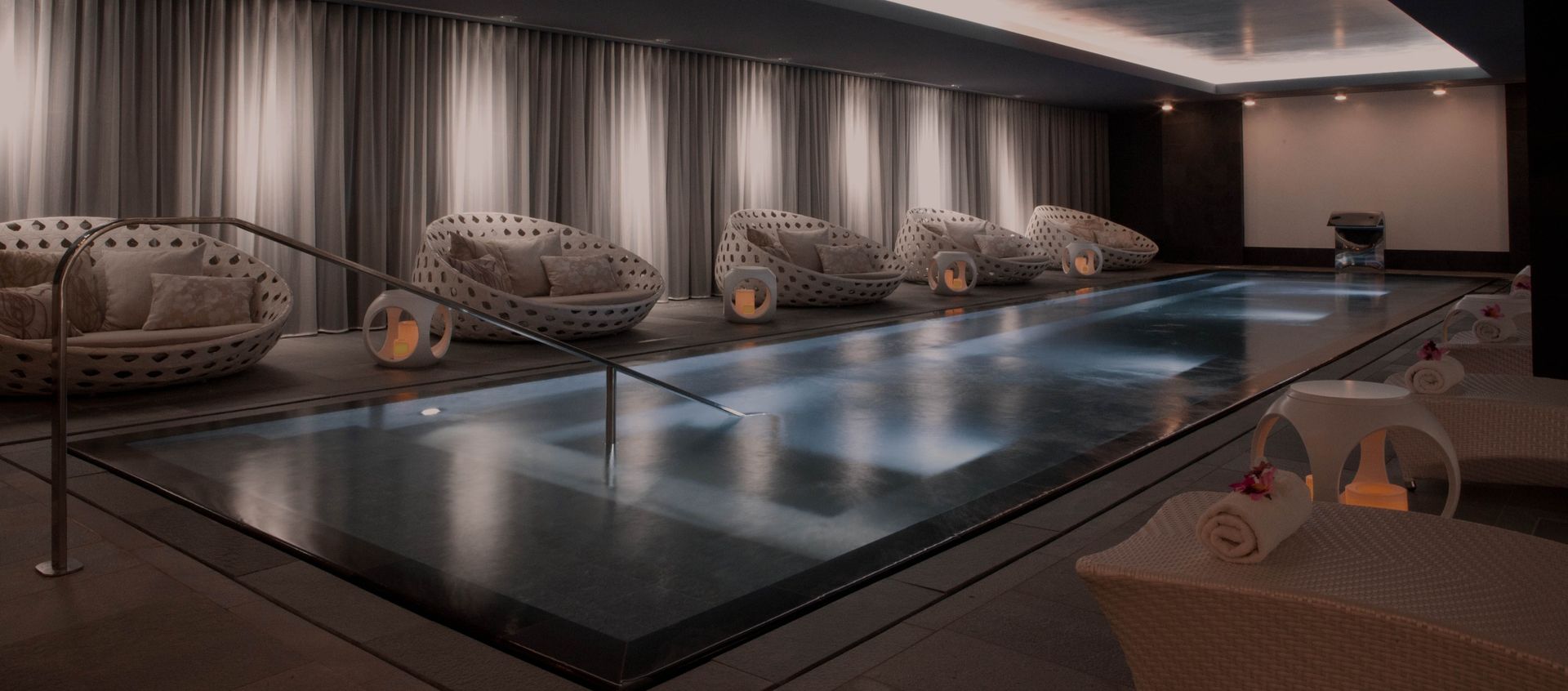 there is a large swimming pool in the middle of the room