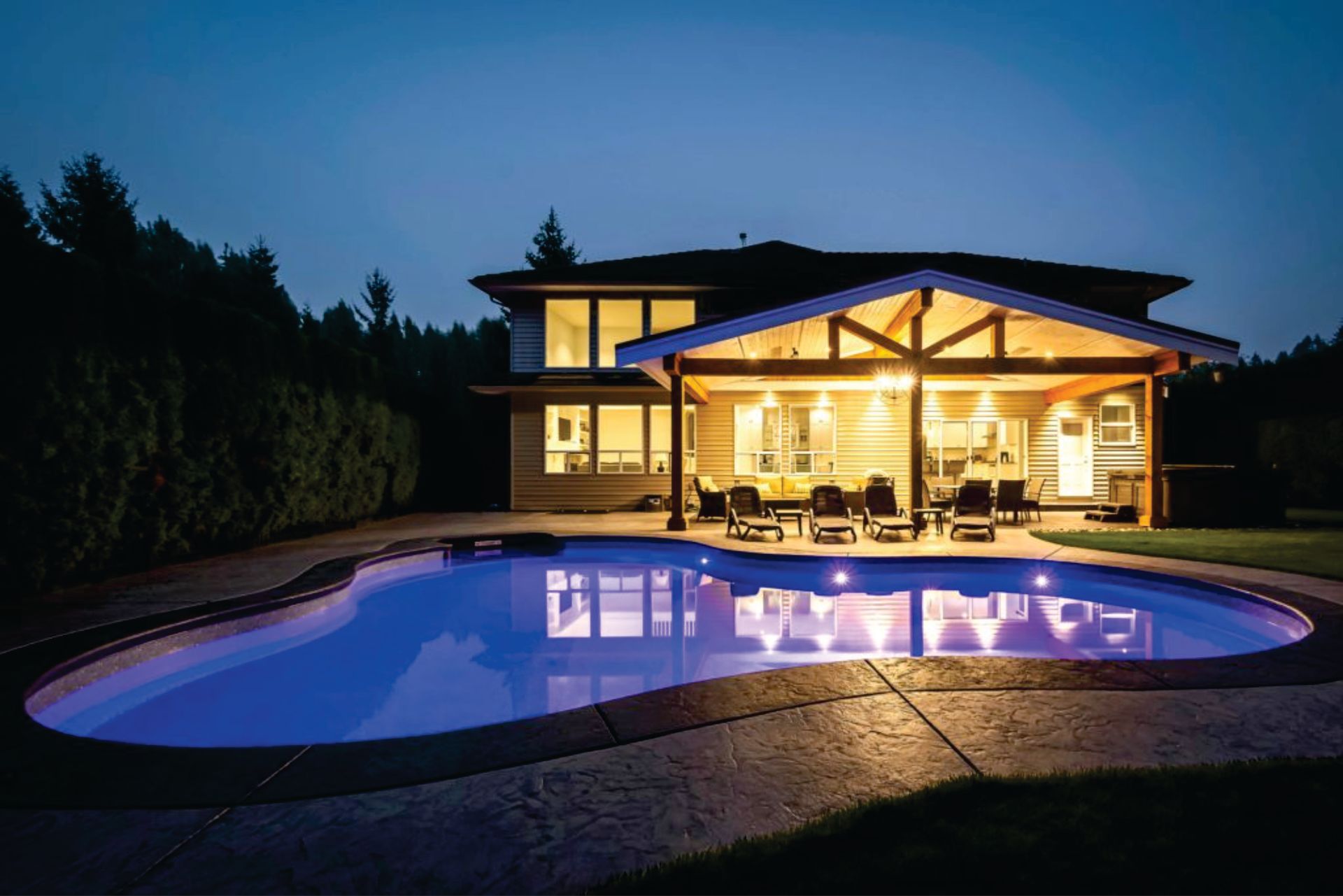 a large house with a swimming pool in front of it