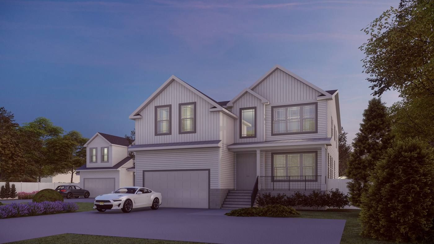 Modern two-story suburban house with gray siding, a white car in the driveway, at dusk