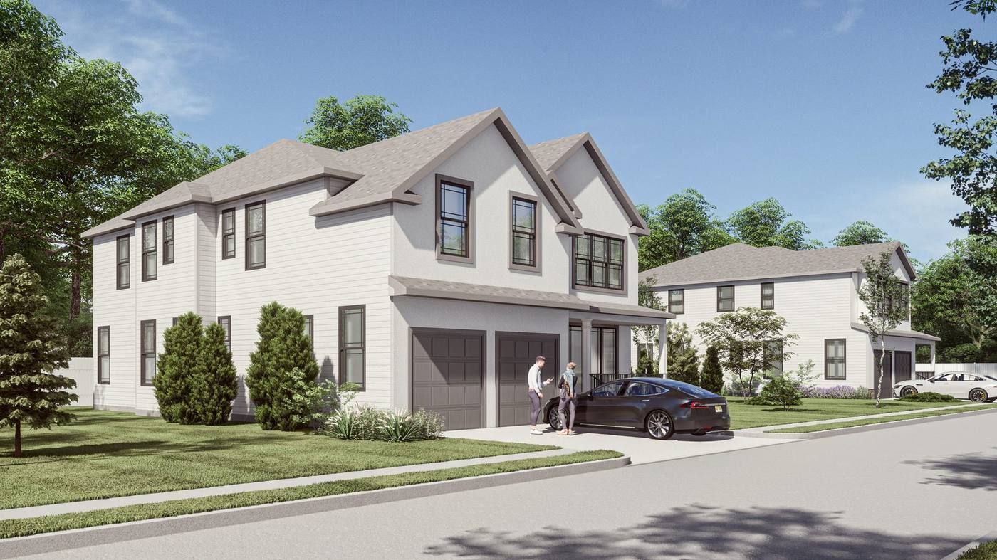 Two-story suburban townhouses with parked car and landscaped lawn along a quiet street