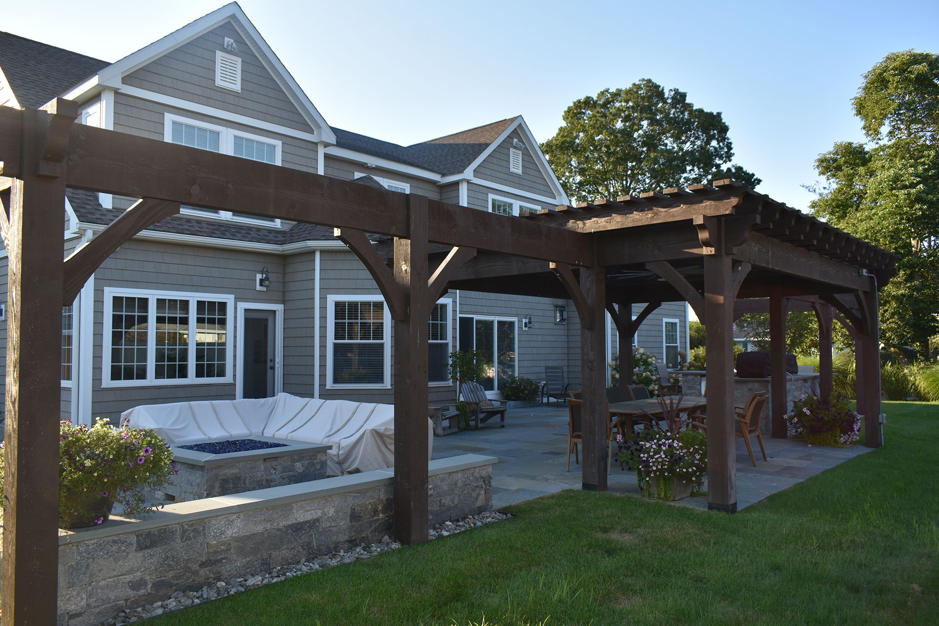 A large house with a pergola in front of it