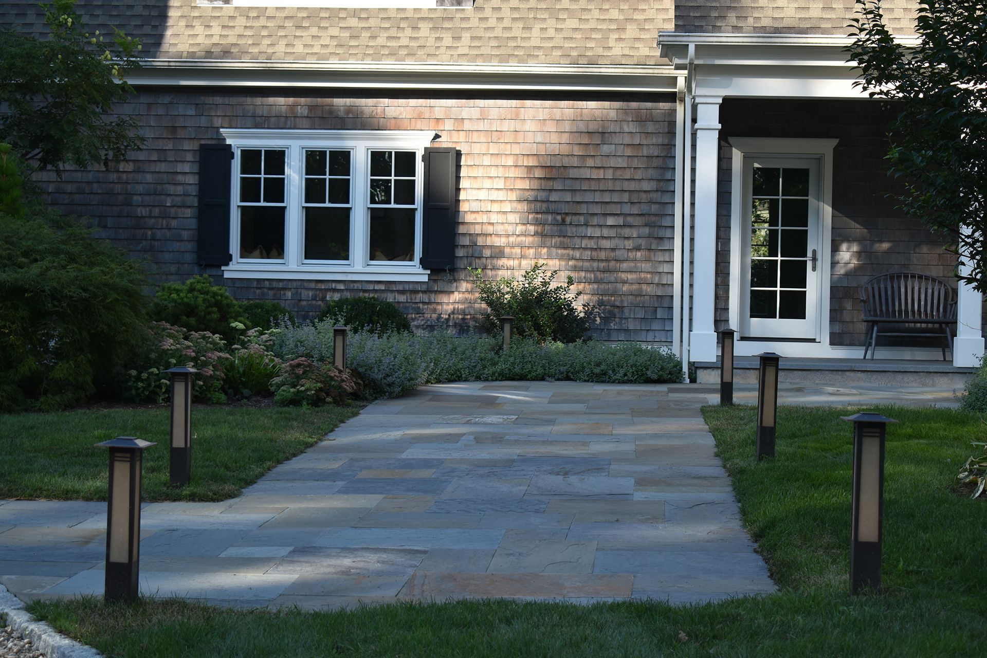 A house with a walkway leading to the front door