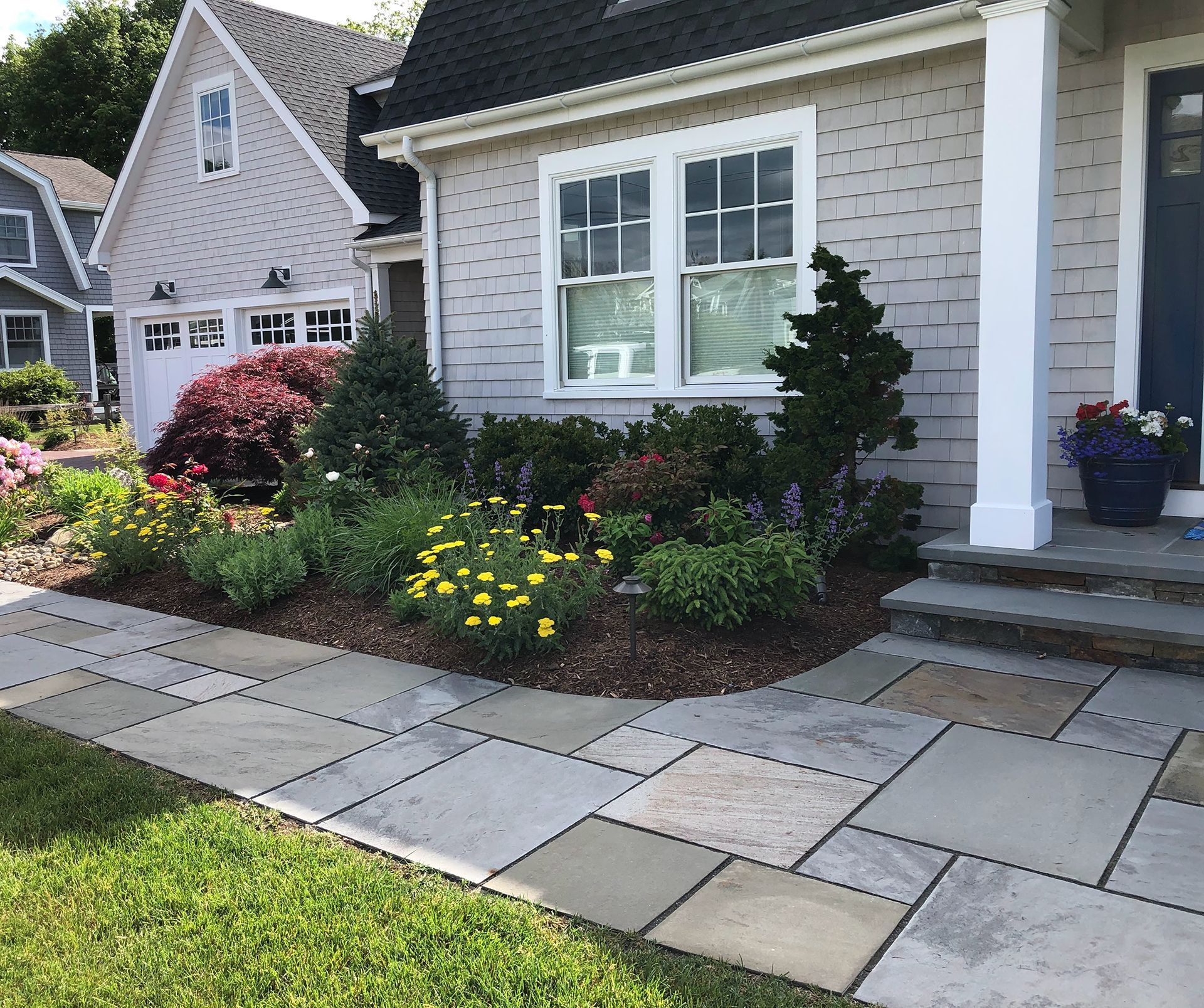 A house with a walkway leading to the front door