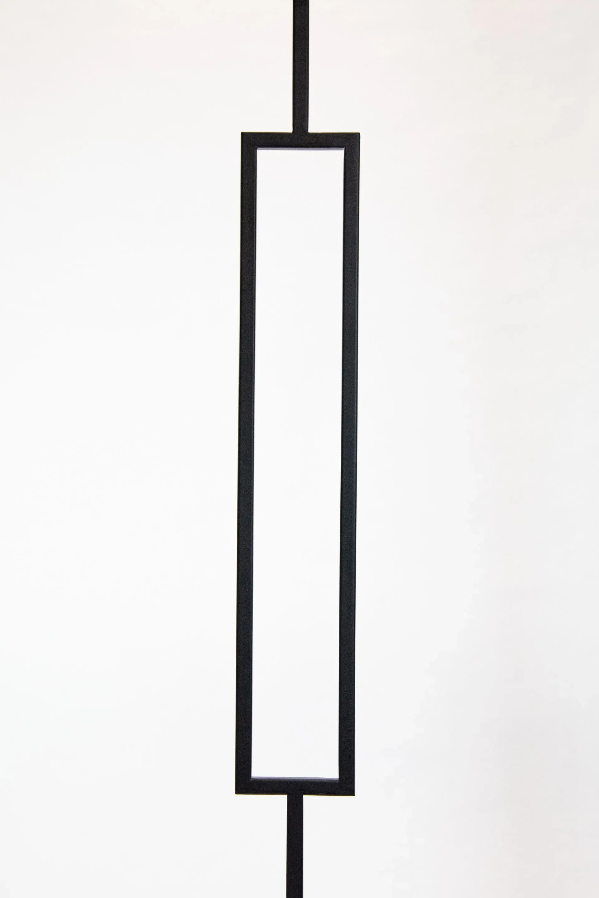 Black rectangular railing against a white background.