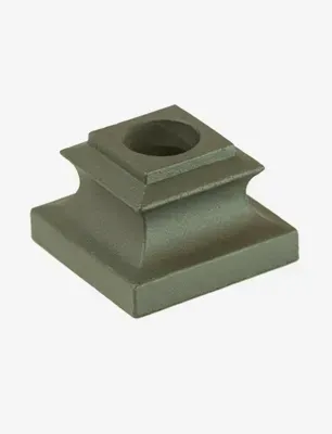 Square, gray metal candlestick base with a central circular opening.