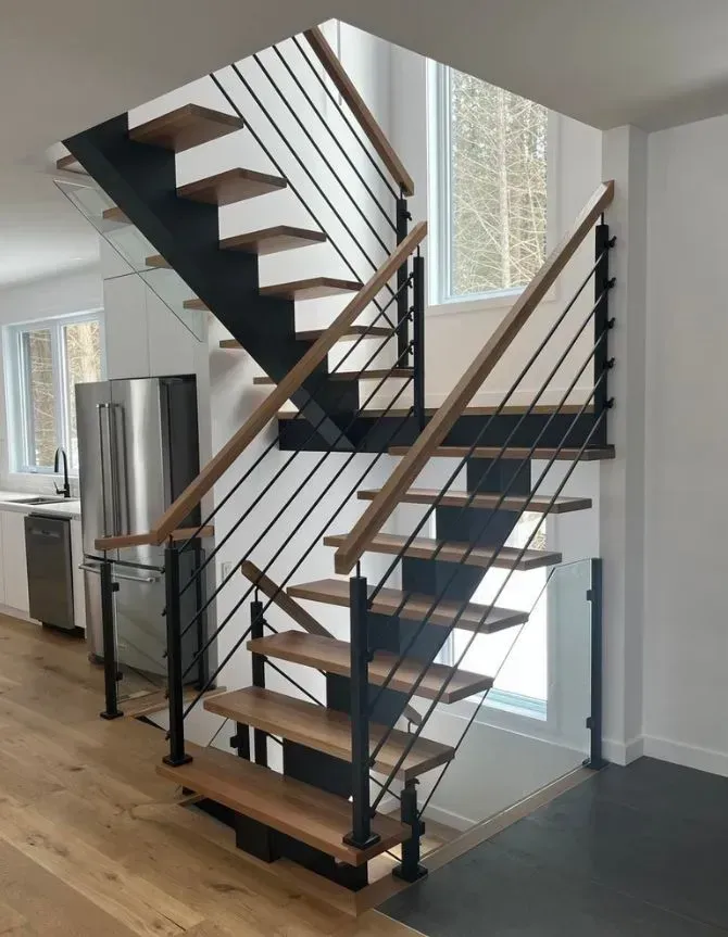 Wooden and black metal staircase with horizontal bars and light-colored treads.