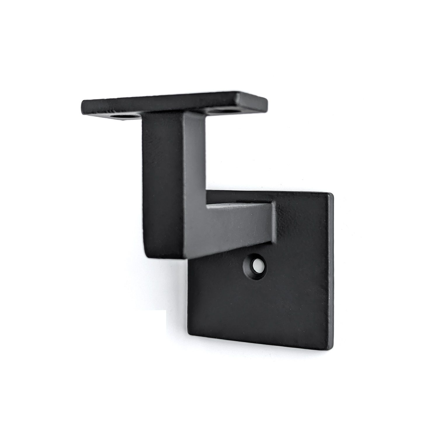 Black metal stair handrail bracket mounted on a white wall.