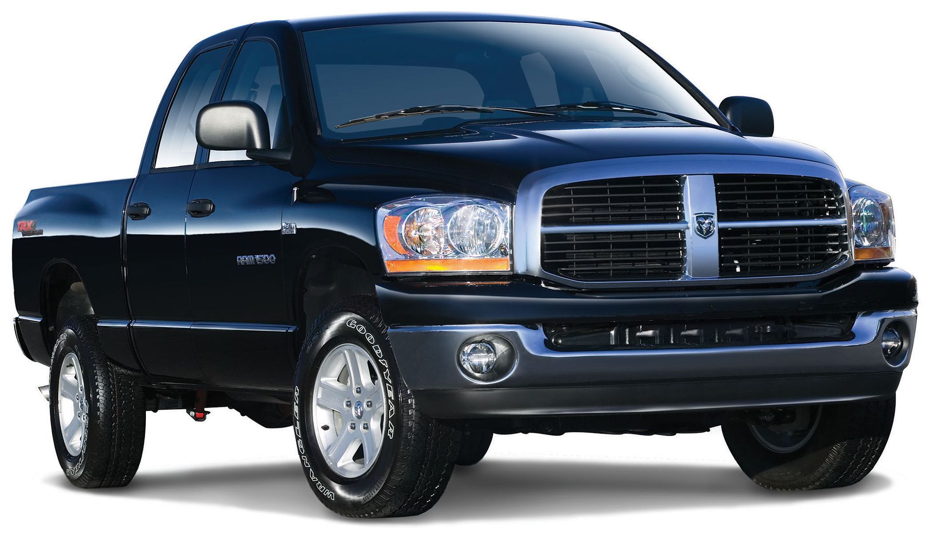 Black pickup truck on a white background, angled front view with chrome grille and large wheels