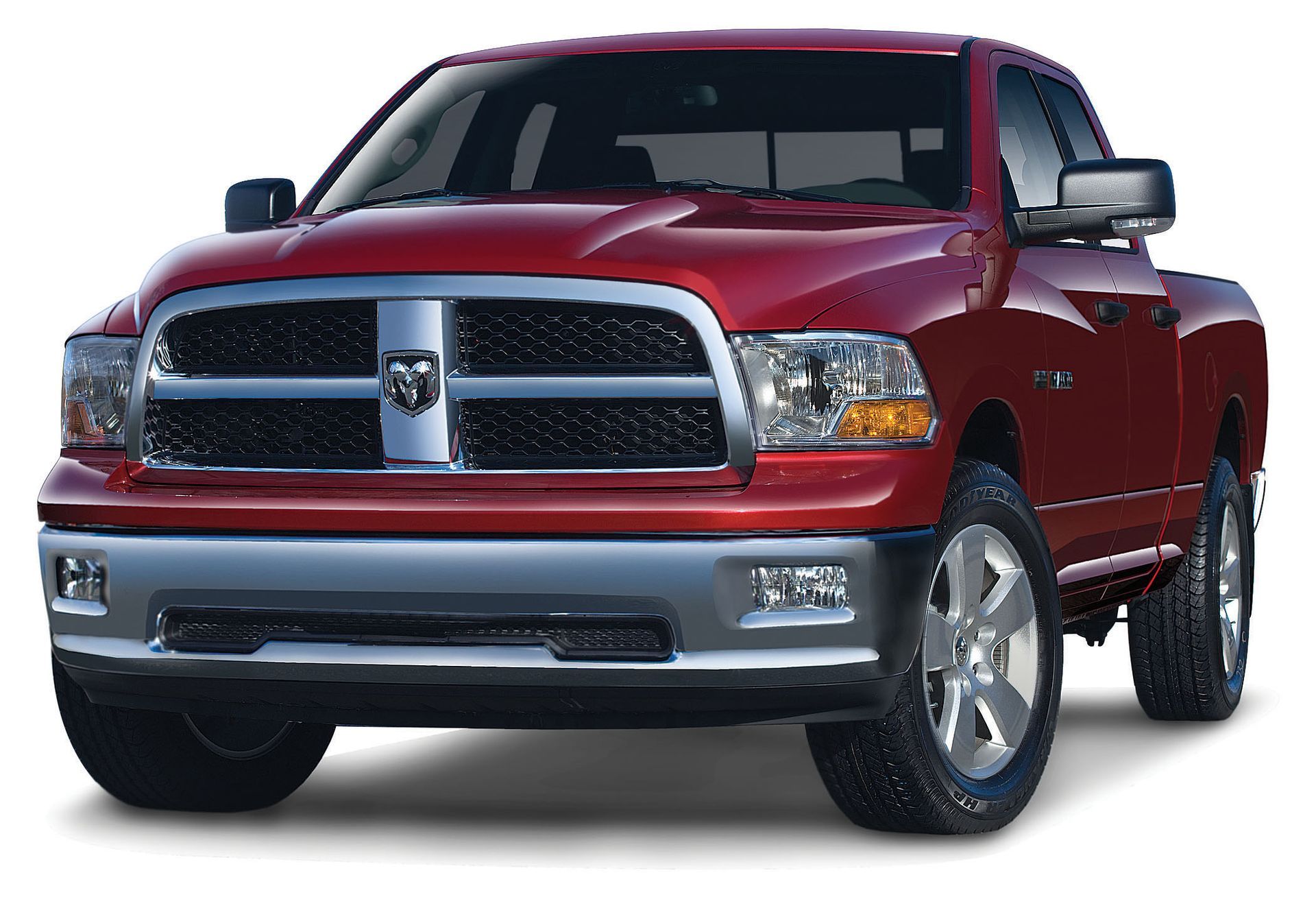 Red pickup truck with chrome grille and bumper, front view on a white background