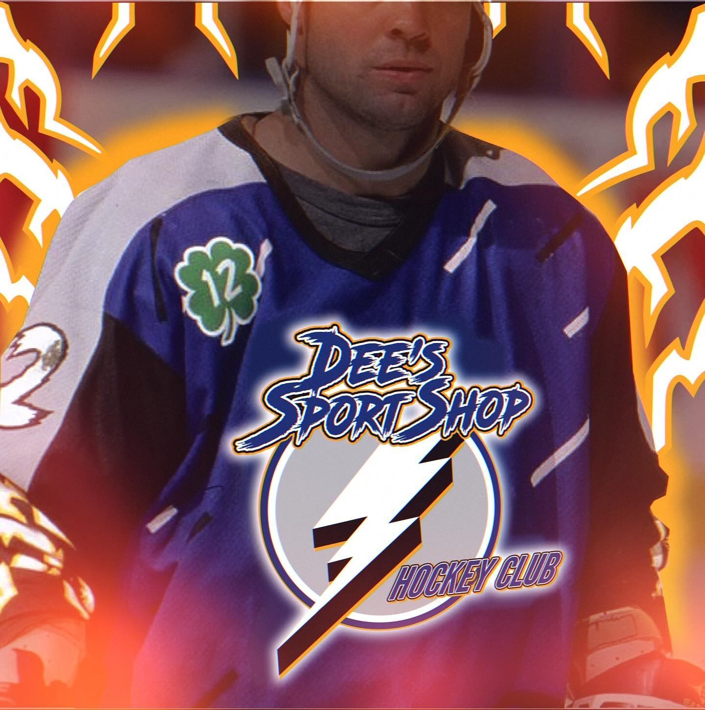 Hockey player in a purple Dee’s Sports Shop jersey with green shamrock and lightning bolt graphic, against orange flames