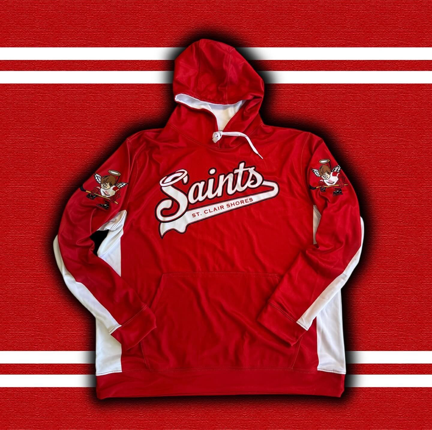Red Saints hooded sweatshirt with white accents laid flat on a red striped background