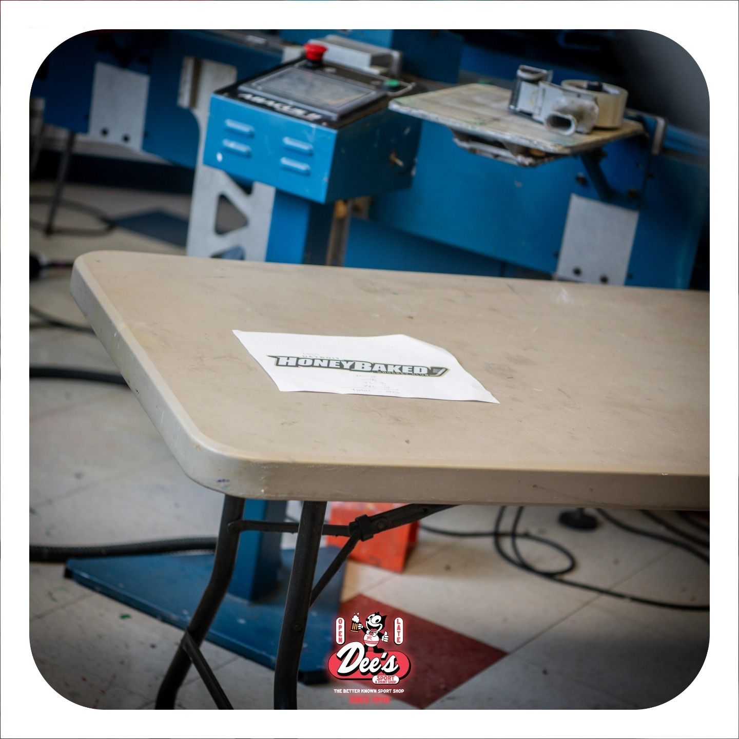 Beige worktable with a paper label in a blue workshop or studio.