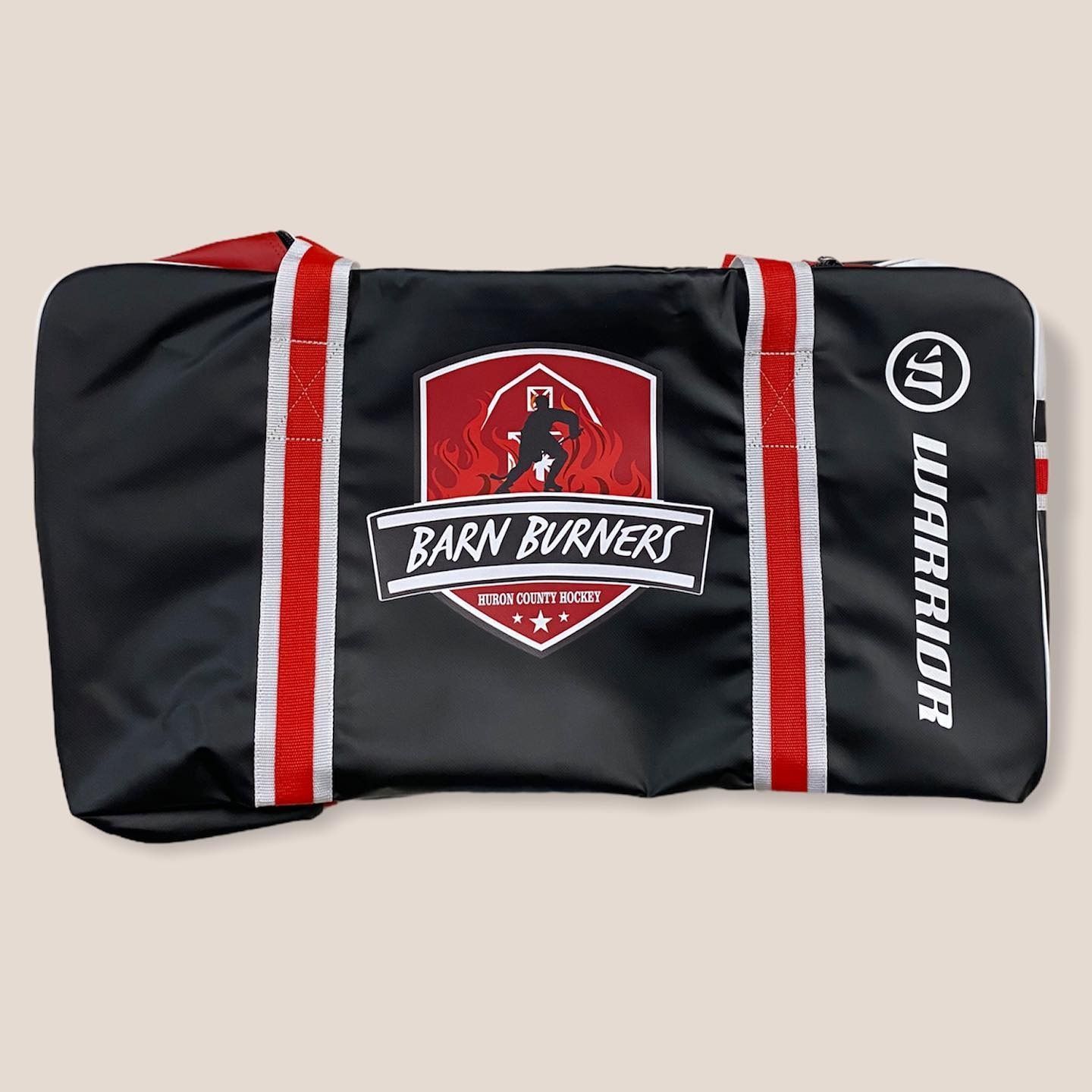 Black and red Ban Runner bag with white stripes and logo on a light background