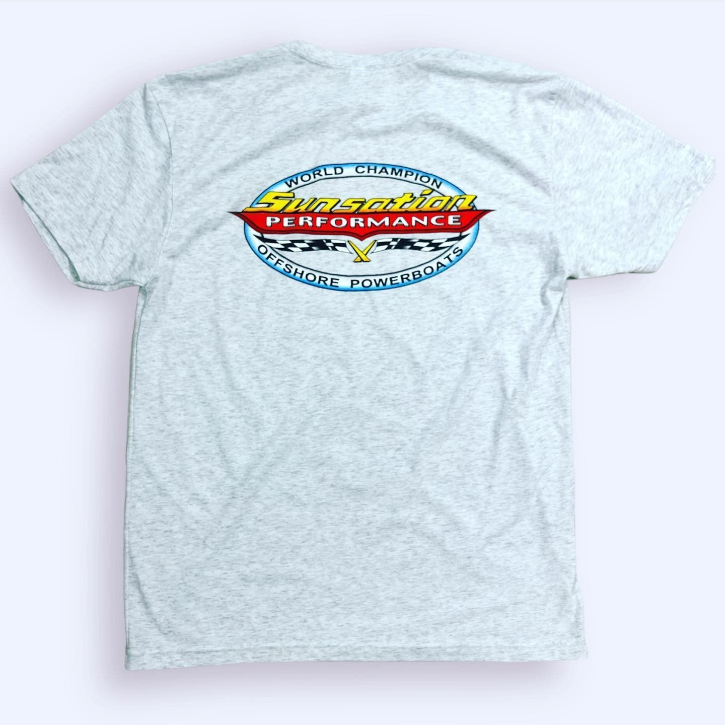 Light gray T-shirt with a colorful oval “Performance” logo centered on the chest