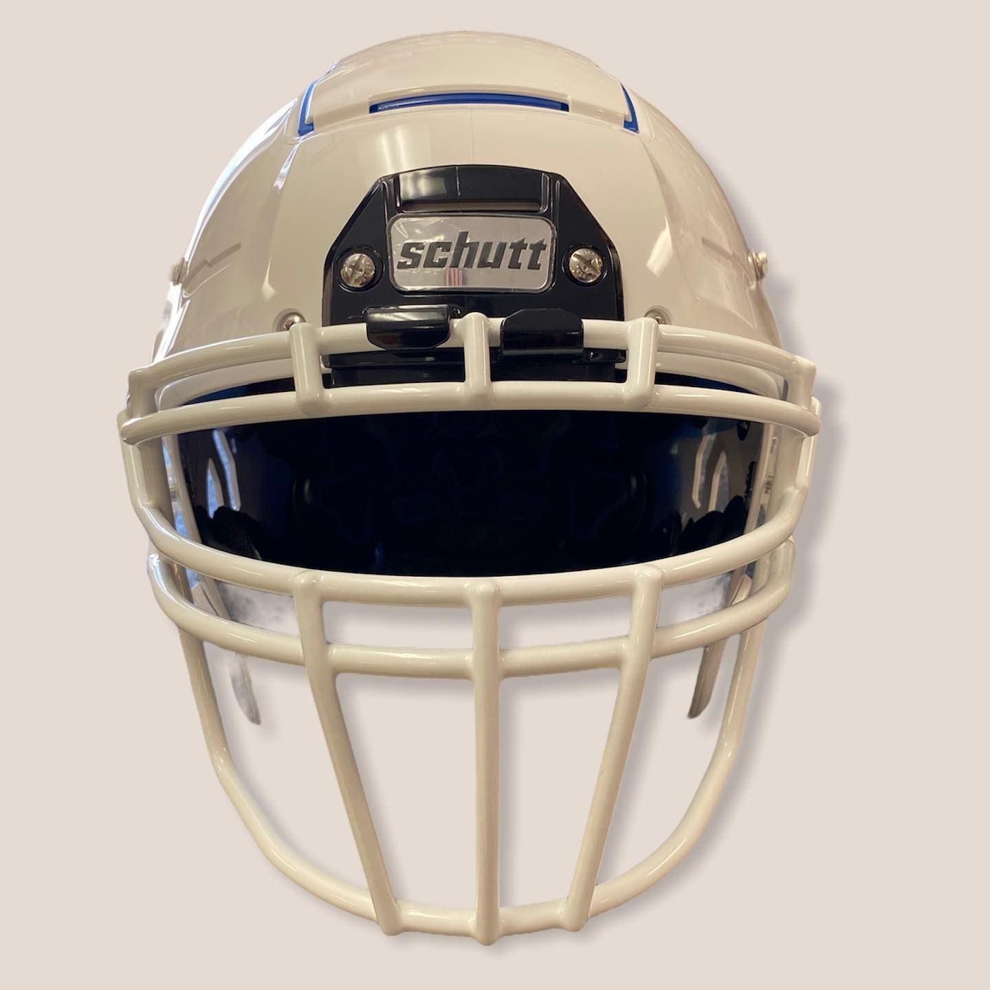 White football helmet with face mask and black visor, featuring a Schutt logo on the front.