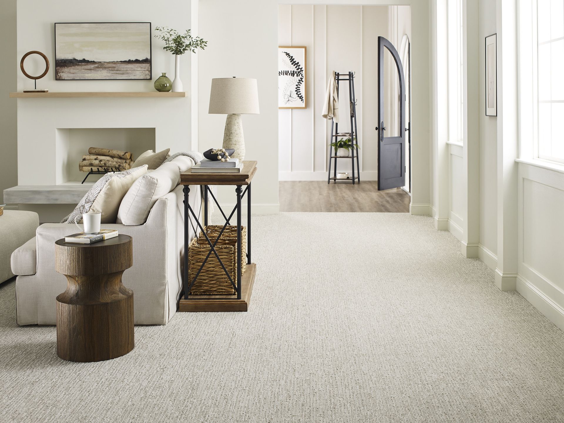 a living room filled with furniture and a fireplace