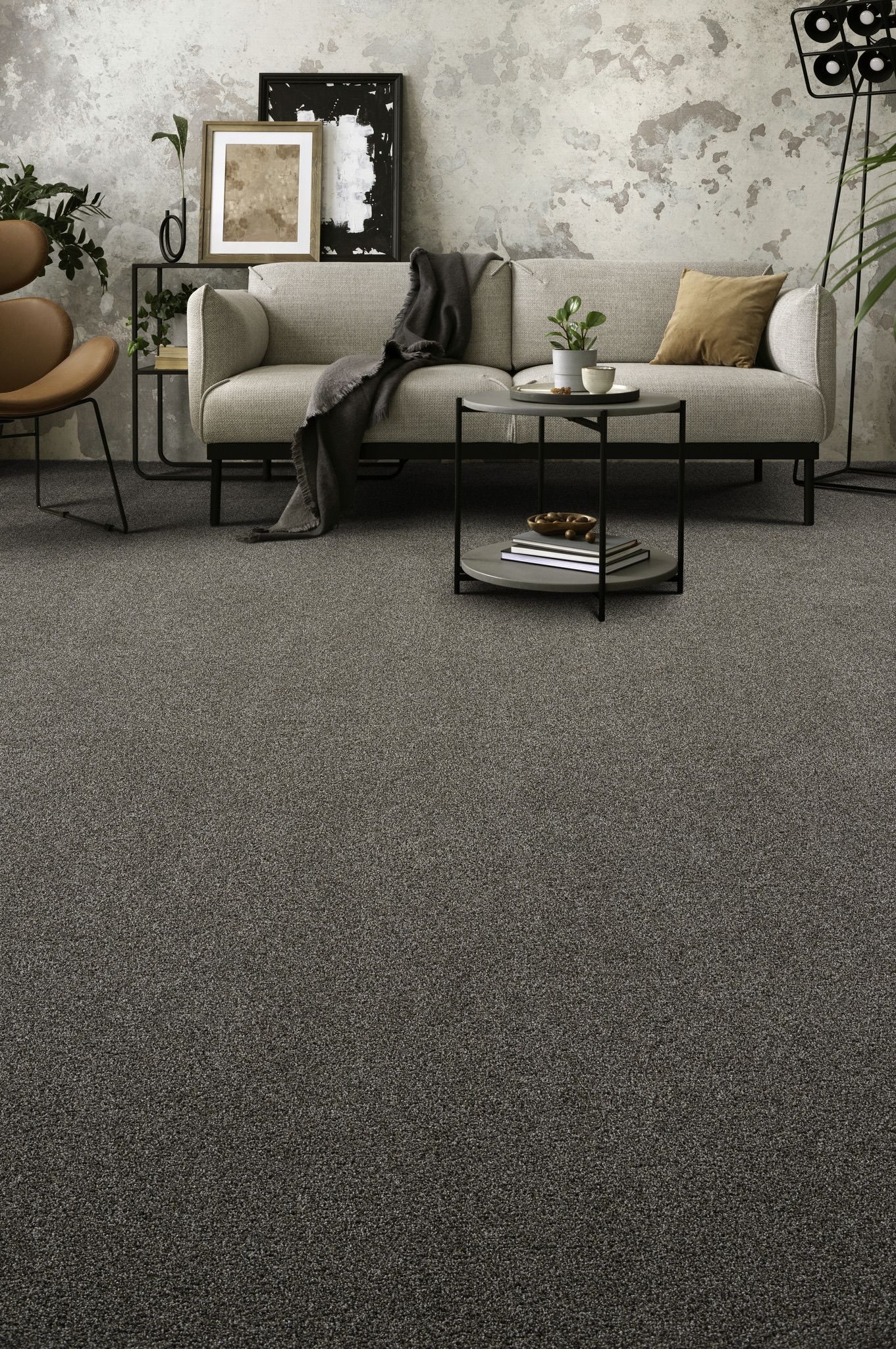 a living room with a couch, chair, table and carpet