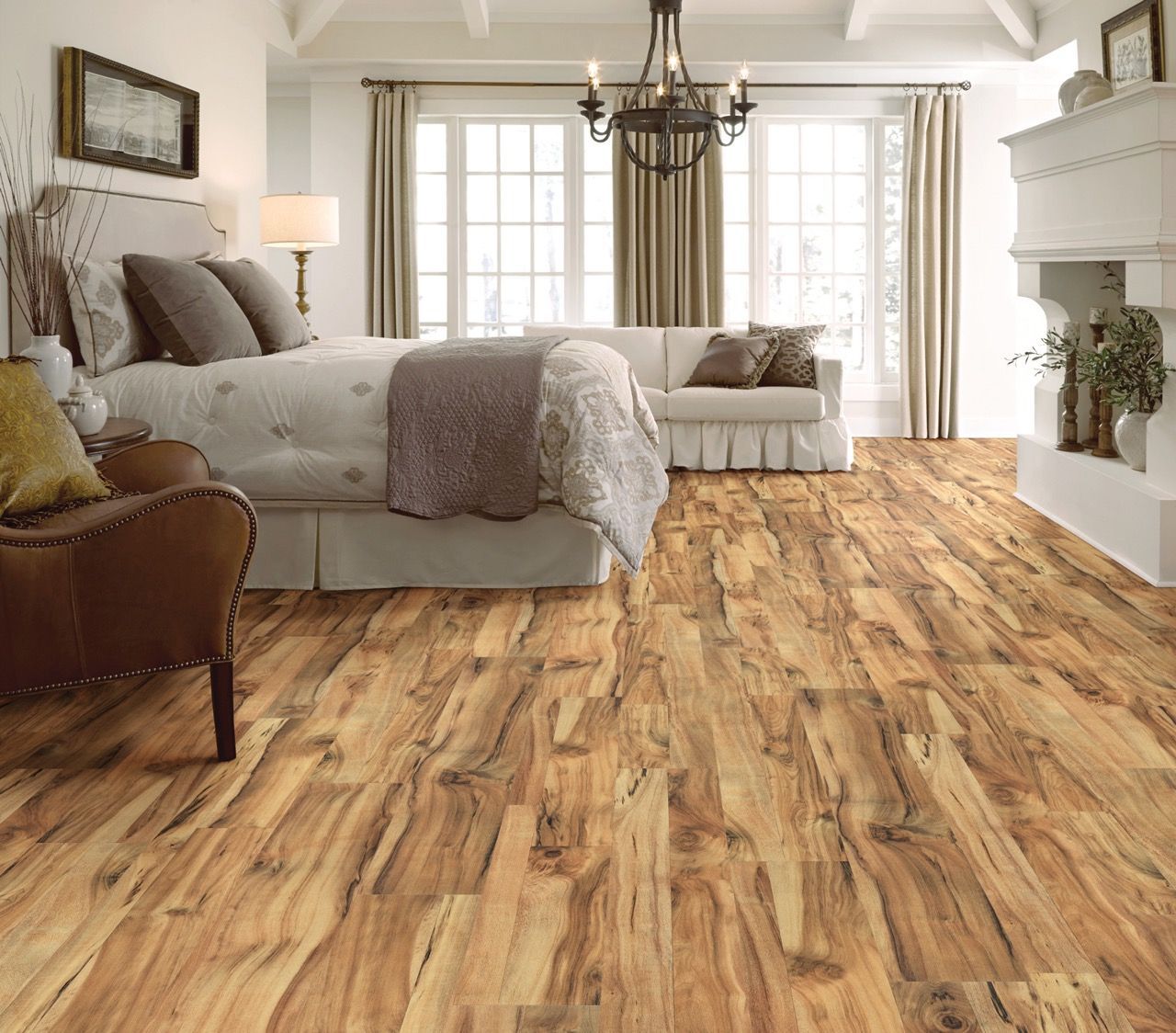 a bedroom with hardwood floors and a bed