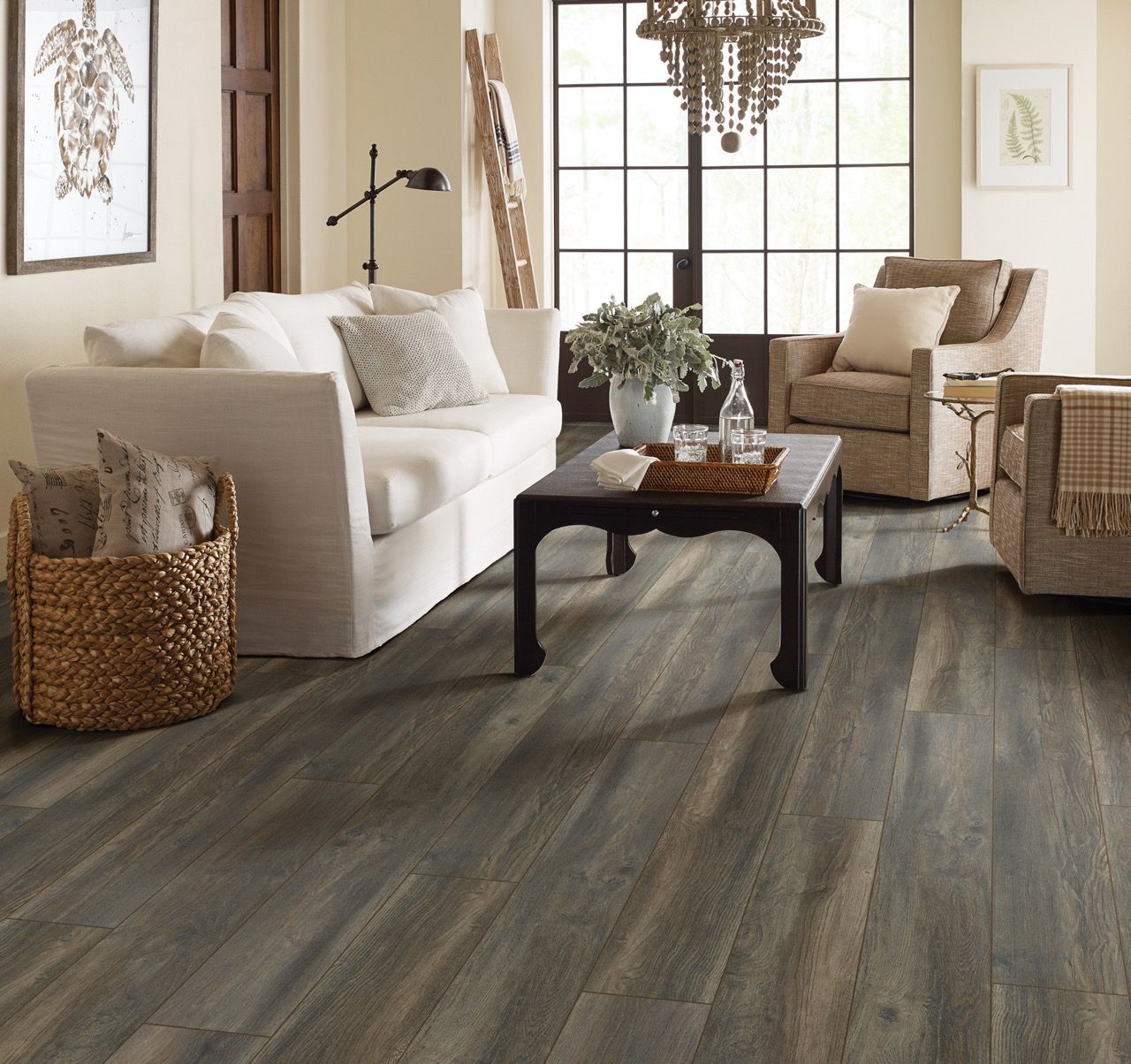 a living room with a couch, chairs and a coffee table