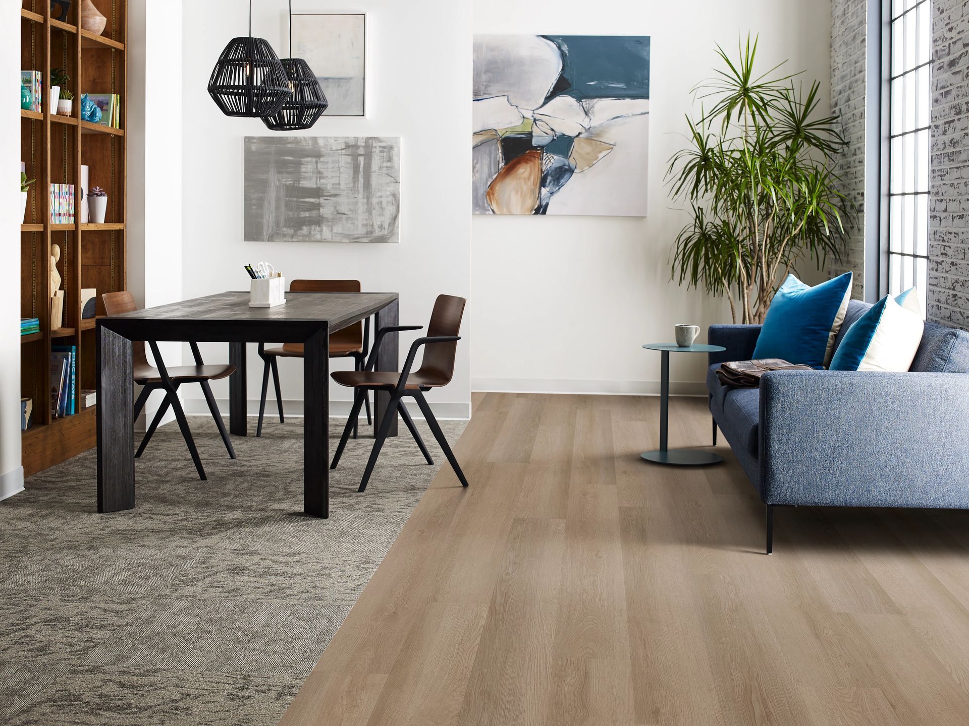 a living room with a couch, table and chairs