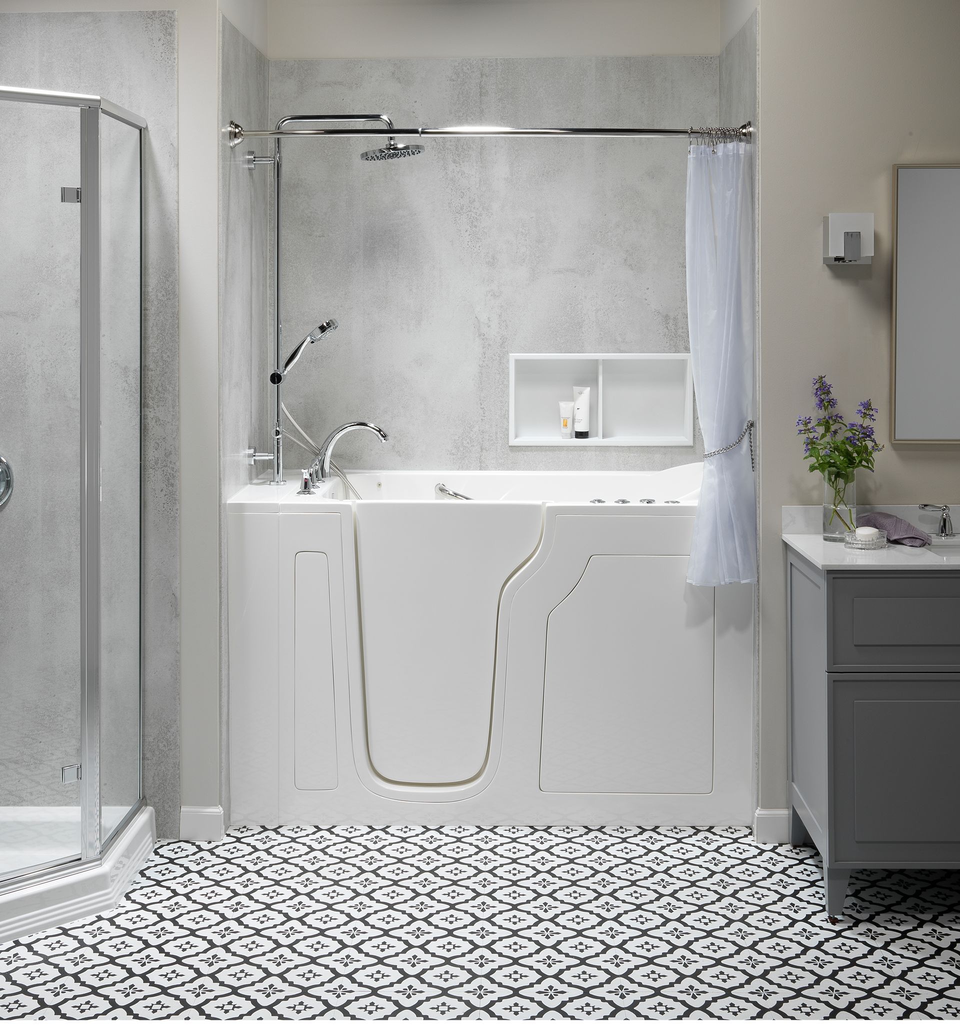 A bathroom with a walk in tub and a walk in shower.