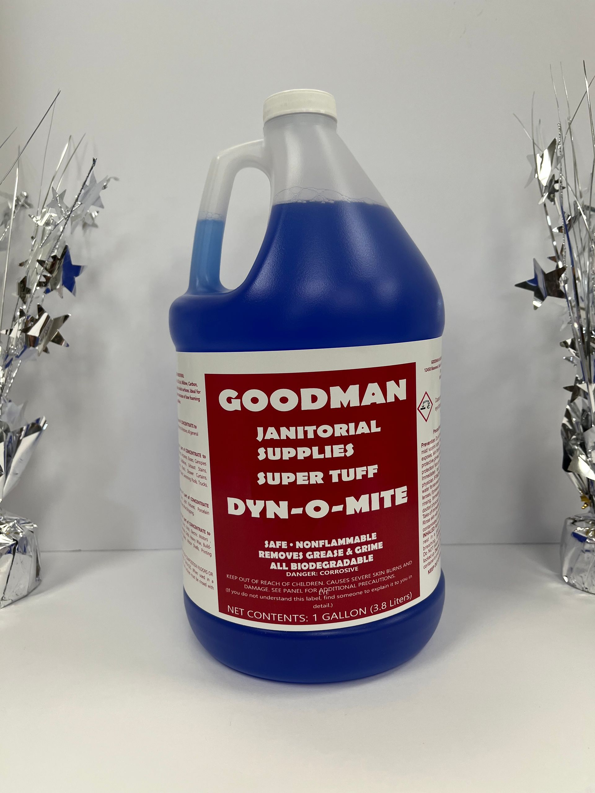 Blue gallon jug of Goodman janitorial floor cleaner with red label, centered on a white background