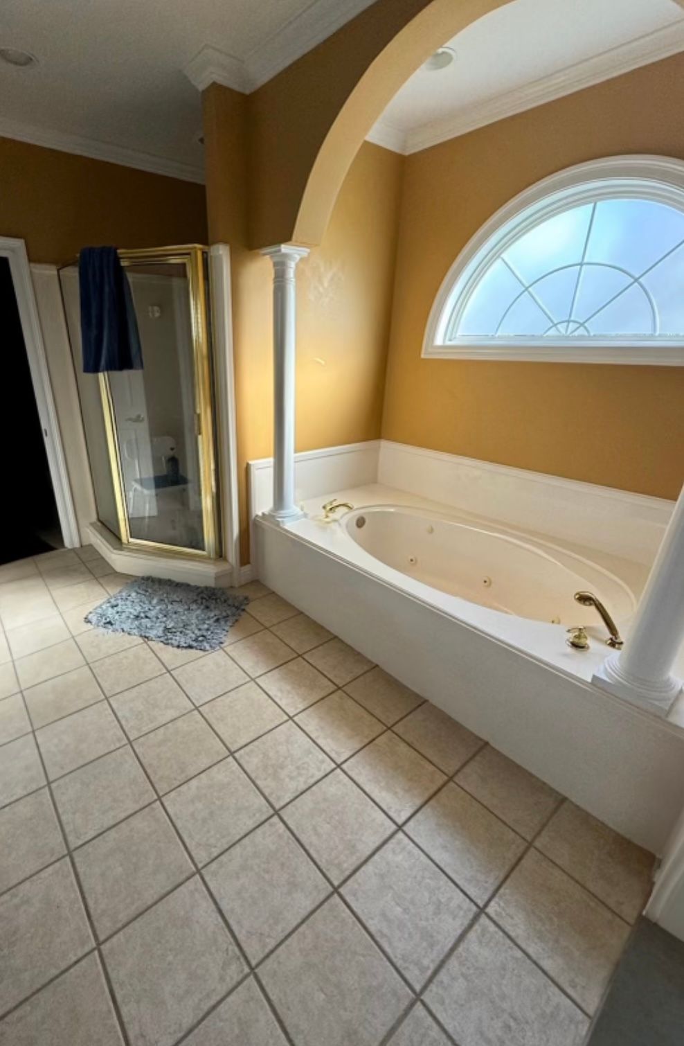 A bathroom with a jacuzzi tub and a shower.