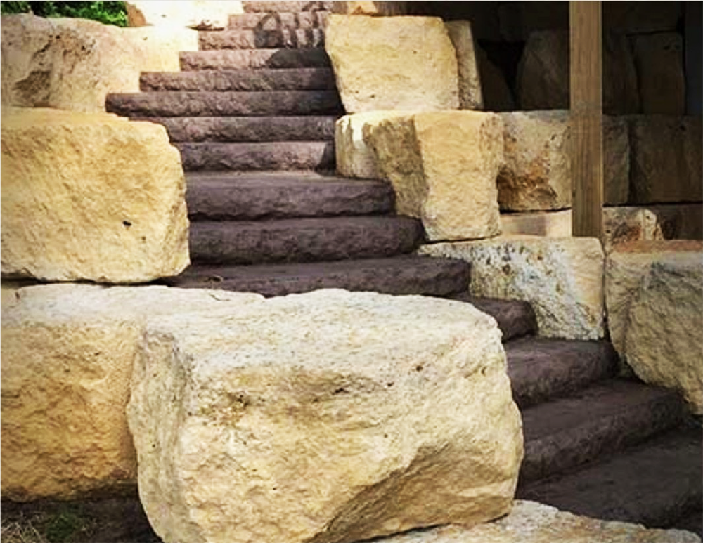 A set of stairs made out of large rocks.