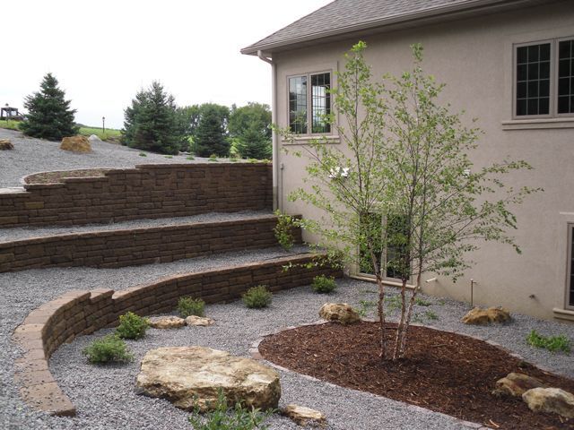 A house with a lot of rocks in front of it.