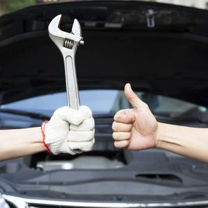 thumbs up and wrench