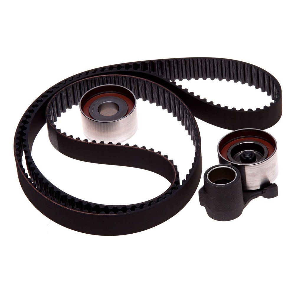 A set of timing belts and rollers on a white background