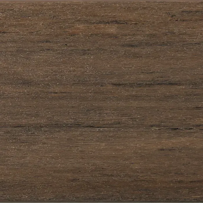 Close-up of composite wood decking with brown and gray tones, showing wood grain texture.