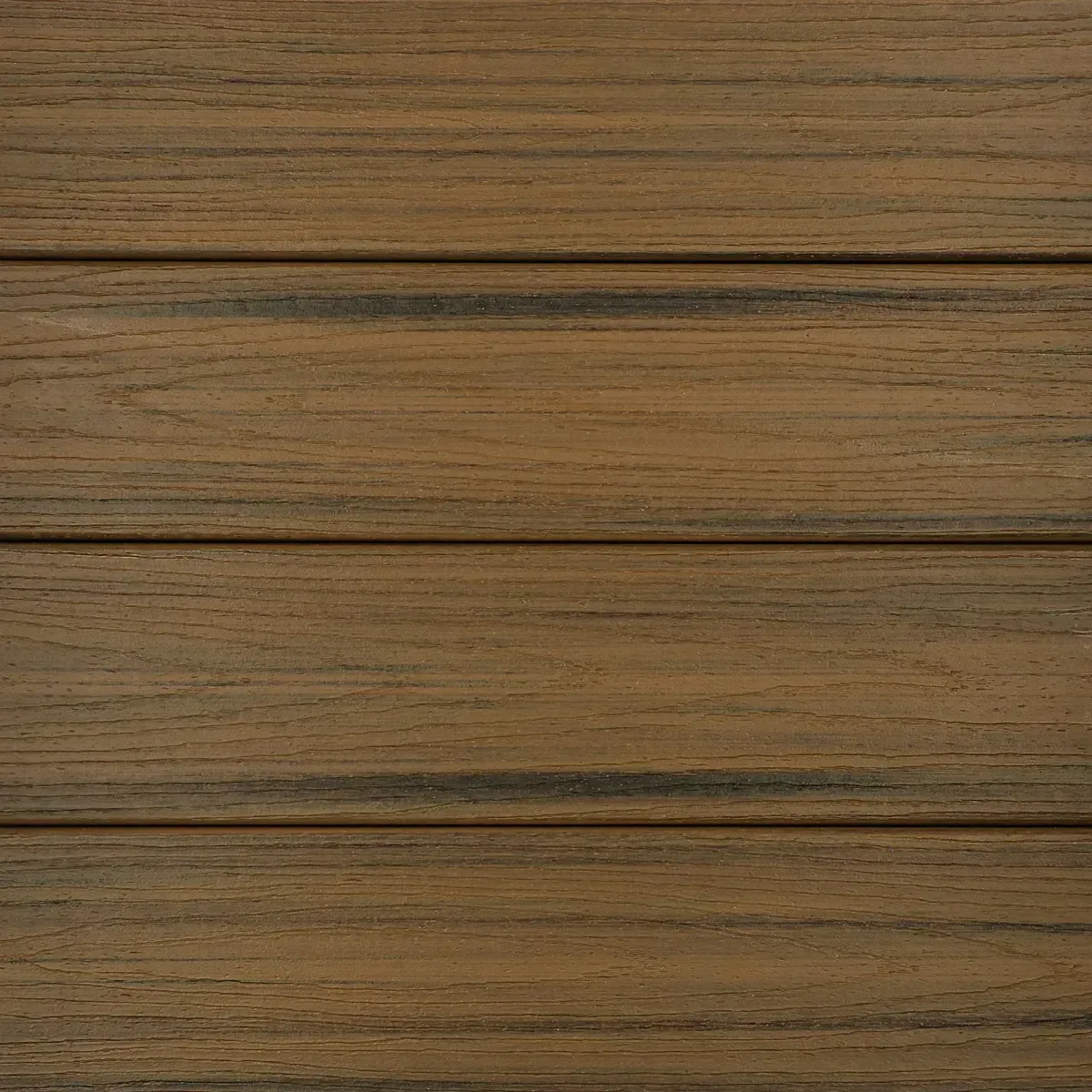 Close-up of brown composite decking planks with grooves, showing wood-like texture.